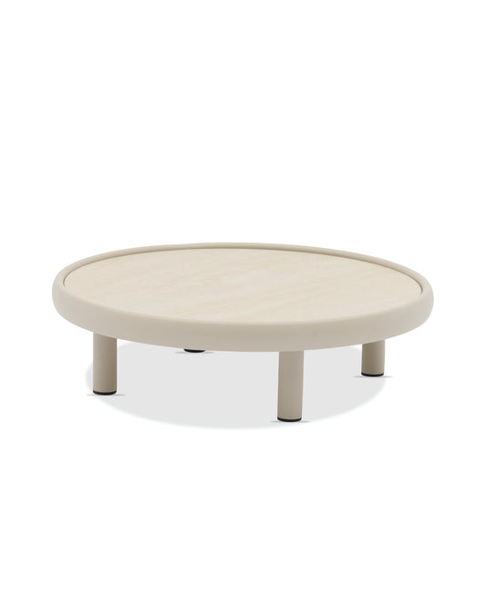 Round beige coffee table on a white background